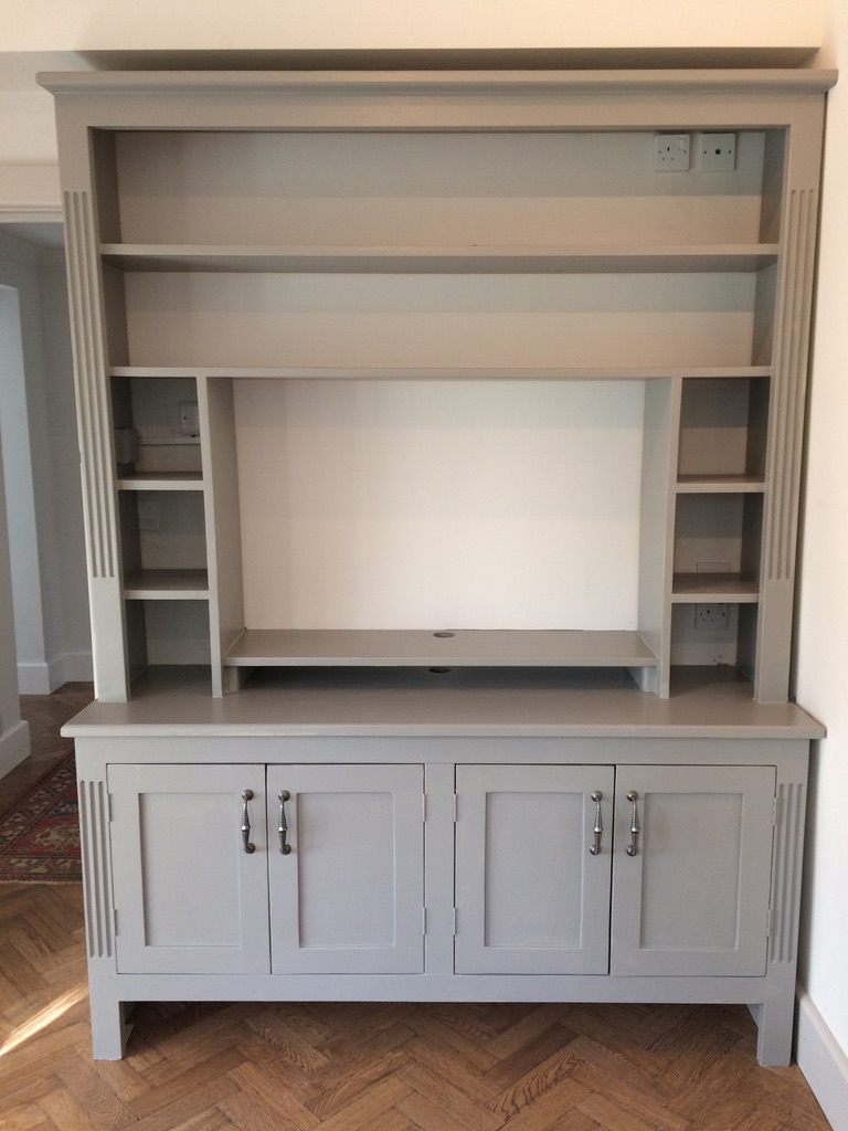 Handmade grey painted dresser and media unit with fluted pilasters, open shelving and panelled cupboards